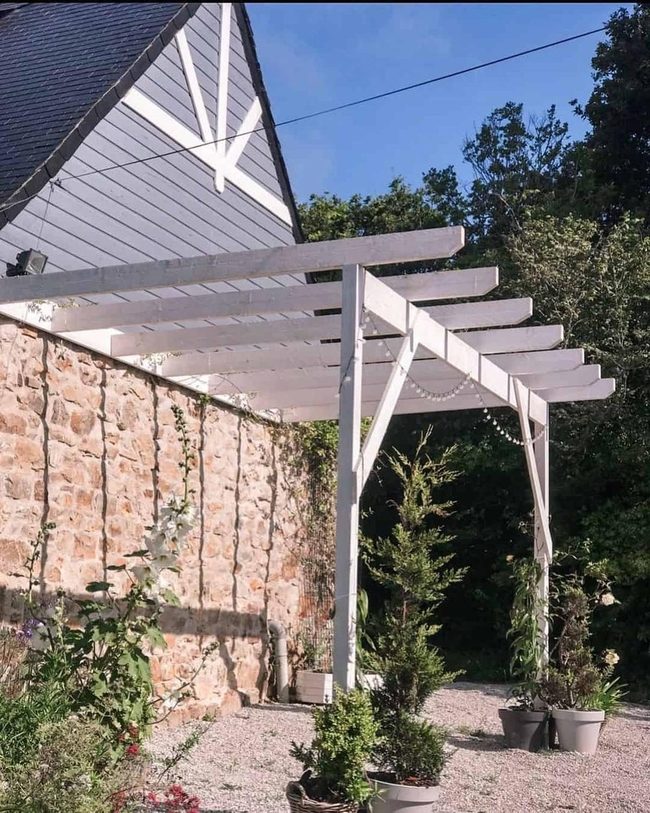 Weathered Stone Pergola With Ivy