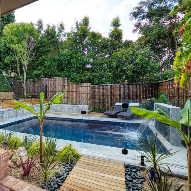 Stacked Stone Terraces Above Pool