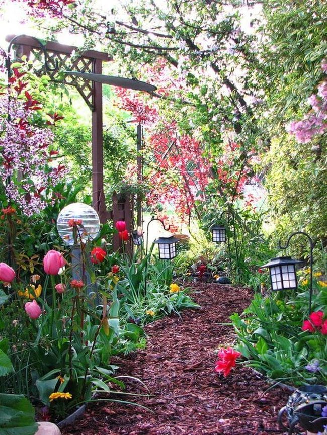 Lantern-Lit Path Through Blooming Garden