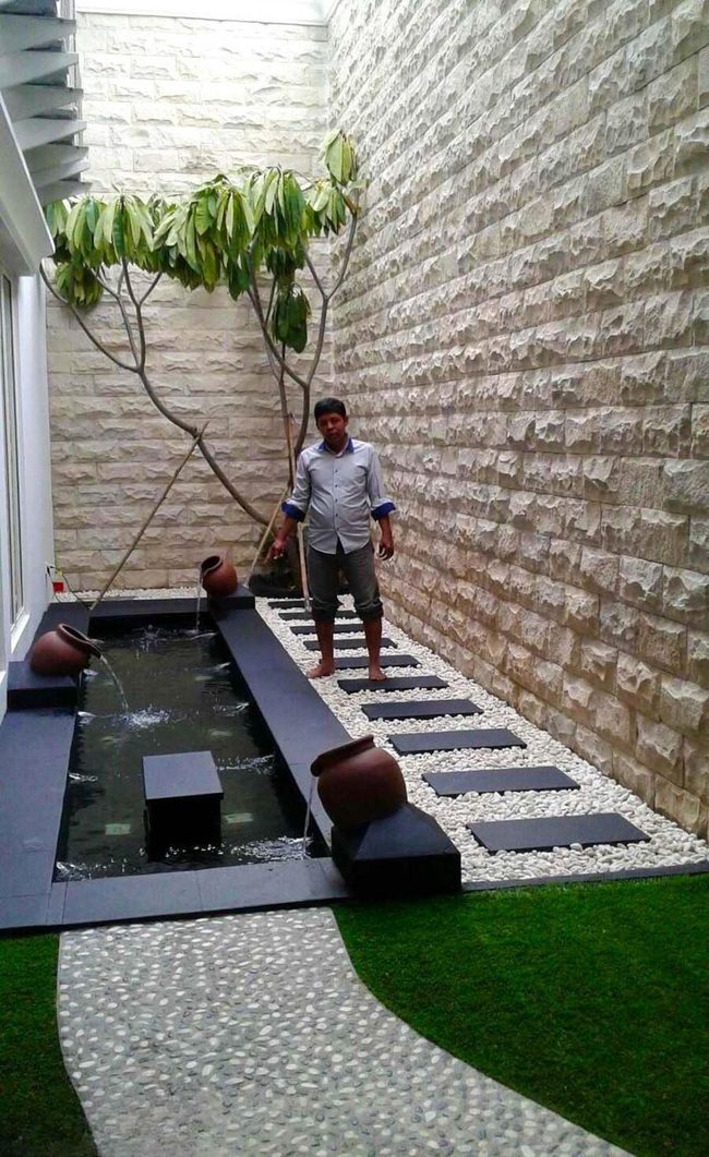 Narrow Pool Through Urban Walls