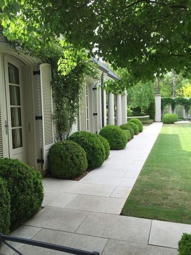White Columns And Stone Pathways