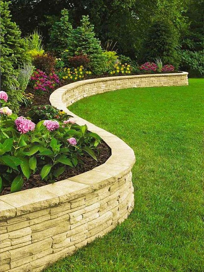 Curved Stone Walls With Overflowing Hydrangeas