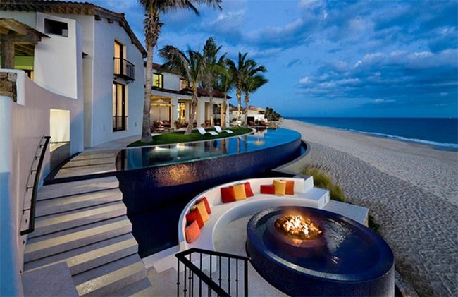 Deep Blue Water Meets Orange Cushions