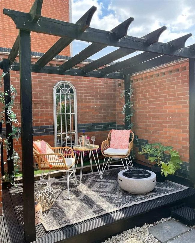 Black Pergola Gray Rug Concrete Pit