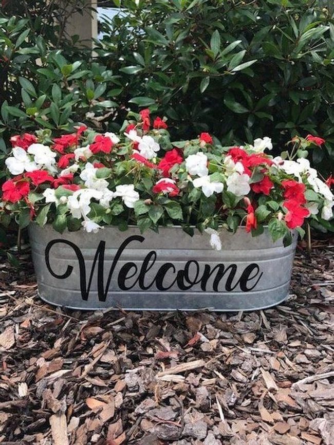 Galvanized Buckets Overflowing With Blooms