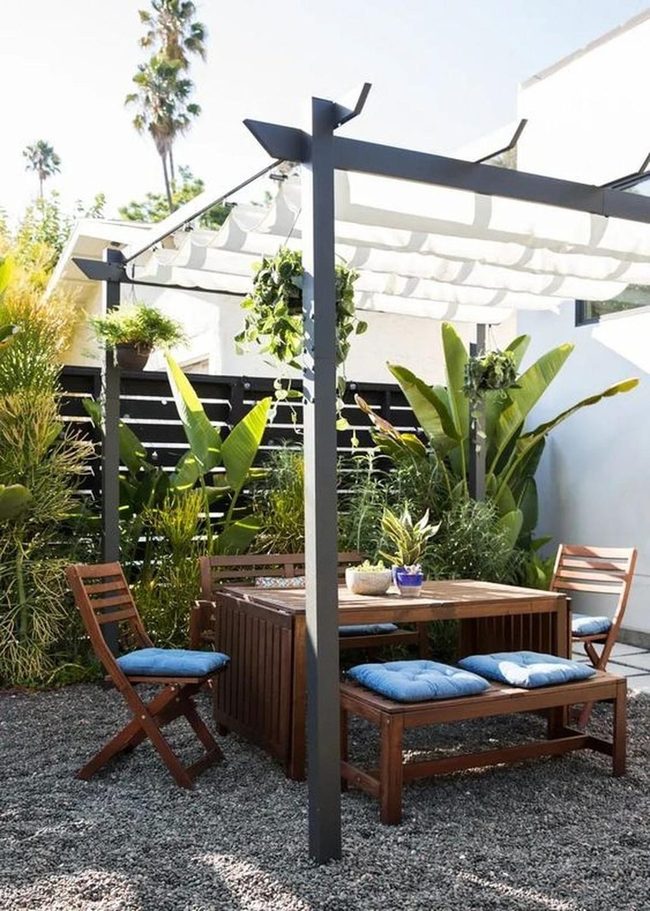 White Fabric Pergola With Blue Seating