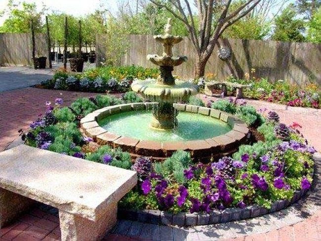 Fountain With Blooming Flower Garden