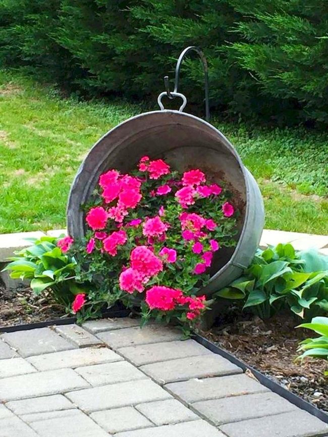 Pink Blooms Spilling From Vintage Metal