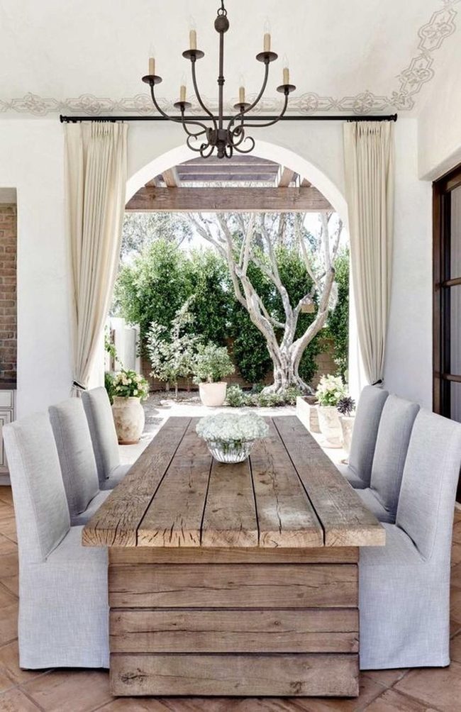 Wooden Tables With Black Chandelier Statement
