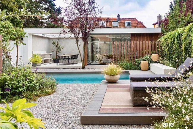 Gravel Pool Deck With Lounge Chairs