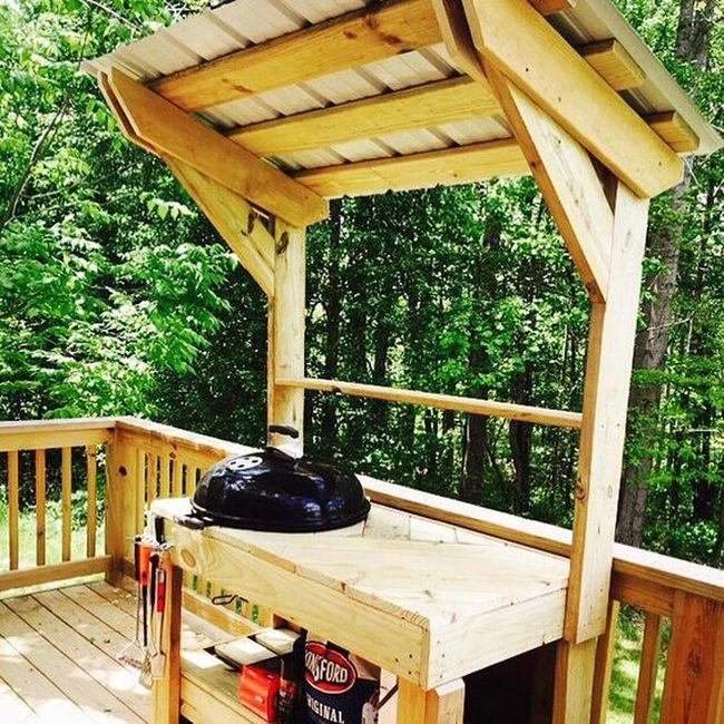 Black Grills On Natural Wood Deck