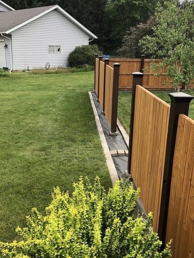 Golden Wood Fence With Open Slats