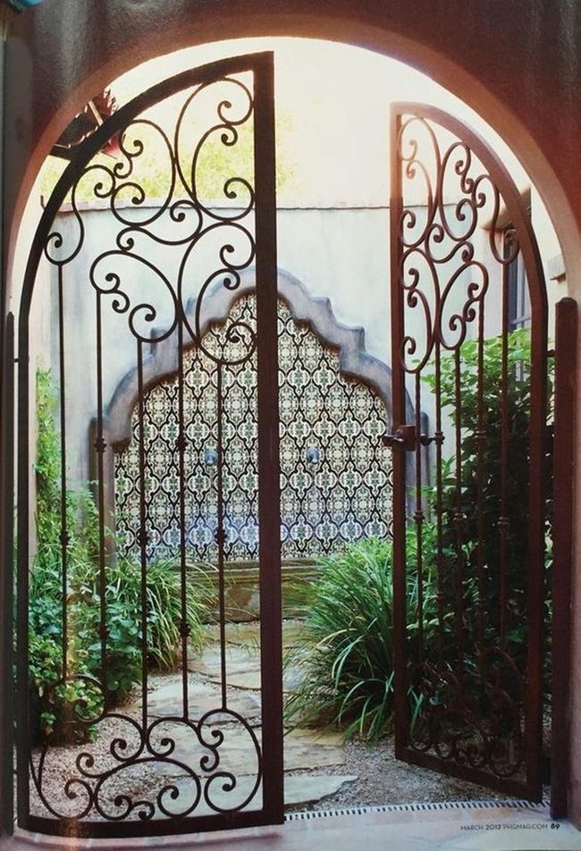 Iron Gates Frame Stone Courtyard