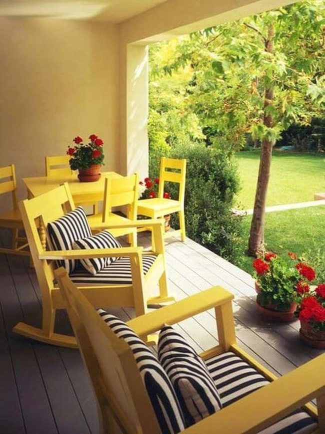 Yellow Chairs And Red Geraniums