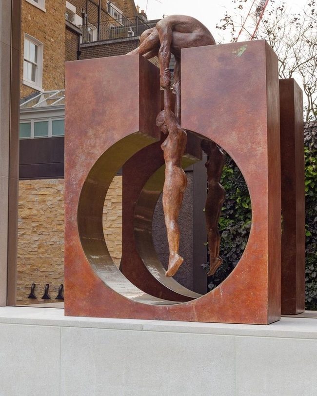 Rusted Metal Figures In Geometric Frame