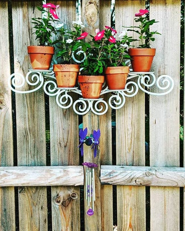 Elevated Pots Transform Plain Fence