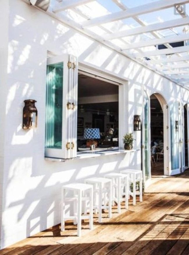 White Pergola With Bronze Lanterns