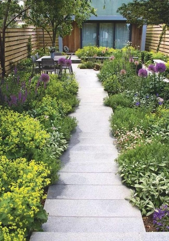 Flower-Lined Path To Glass Doors