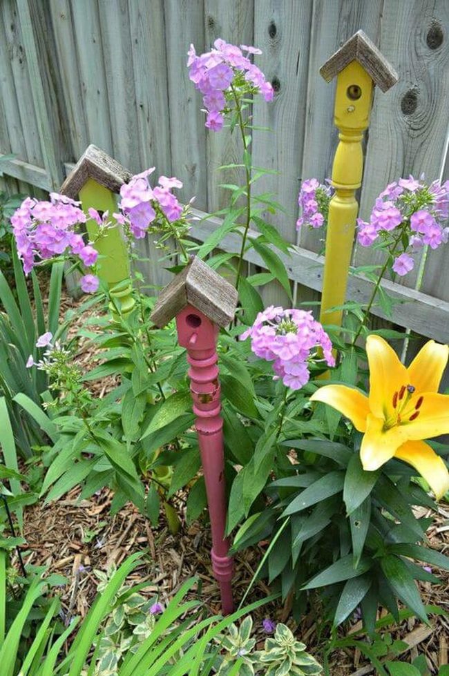 Painted Poles Pink Yellow Birdhouses