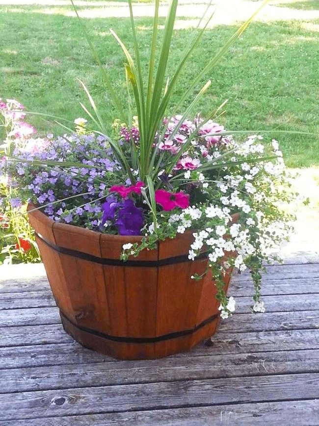 Cascading Flowers In Wooden Barrels