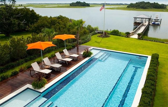 Orange Umbrellas Over Blue Water