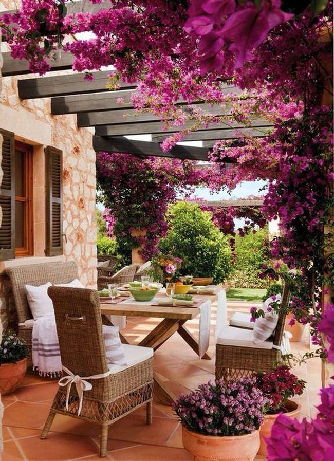 Pink Adobe Porch With Cascading Flowers