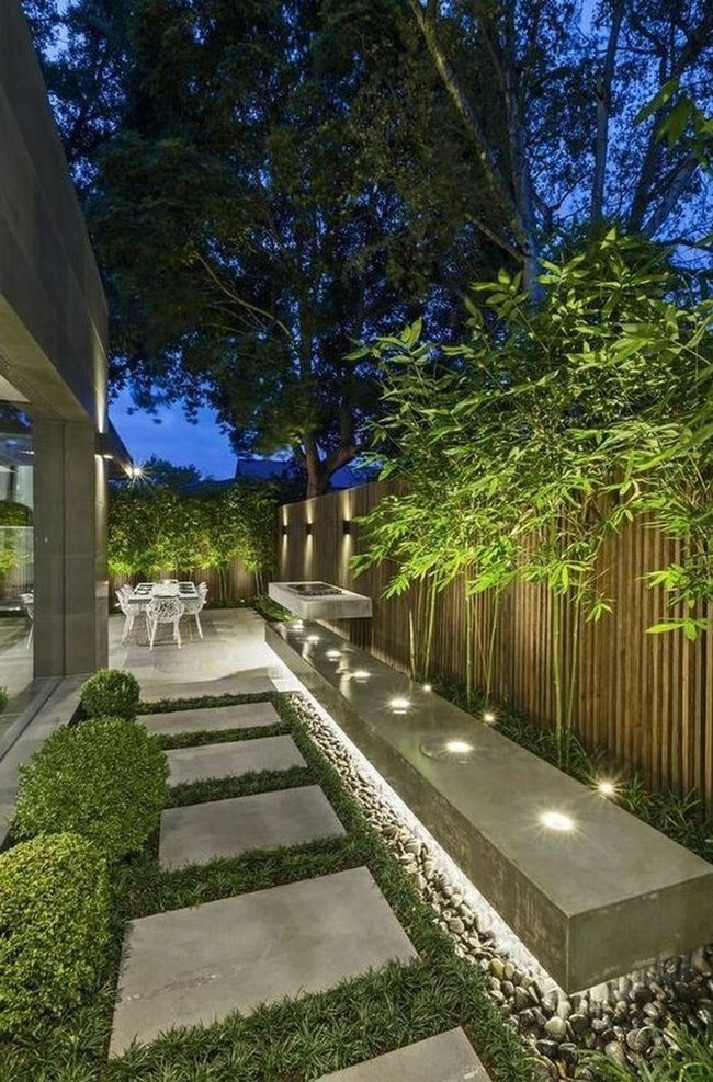 Illuminated Bench In Lush Garden