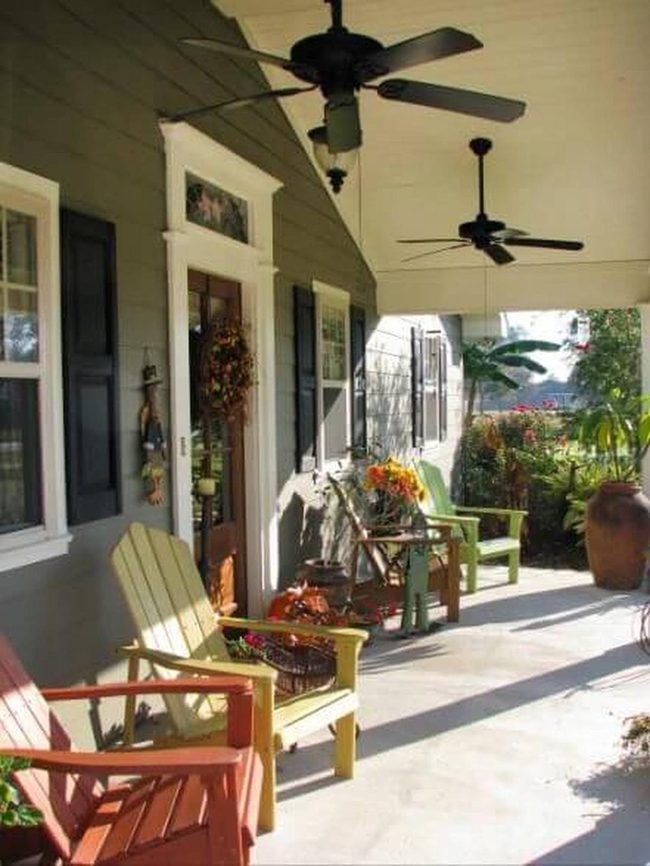 Colorful Adirondack Chairs On Porch