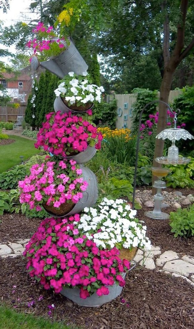 Flowers Tumbling From Stacked Containers
