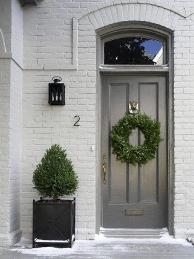Gray Door With Festive Green Wreath