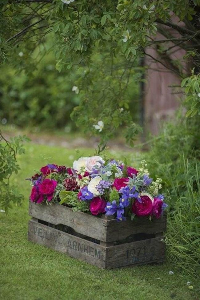 Wooden Crates Overflowing With Purple Blooms