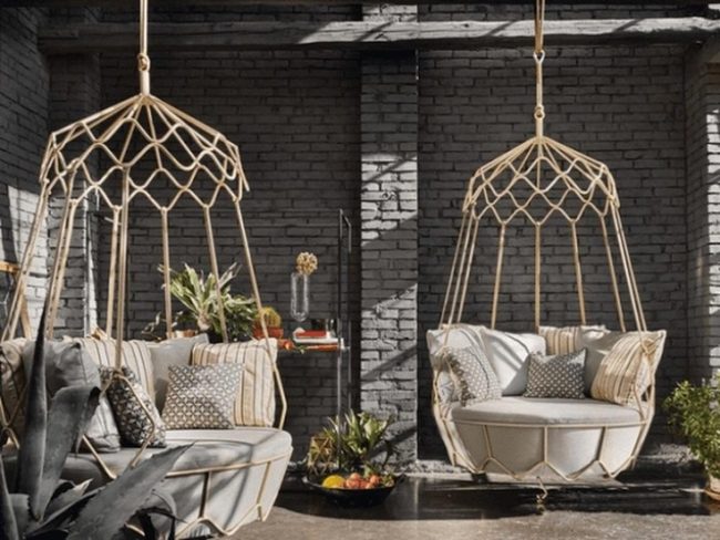 Gray Brick Retreat With Hanging Chairs