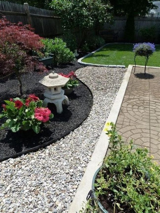 Red Blooms In Structured Garden Space