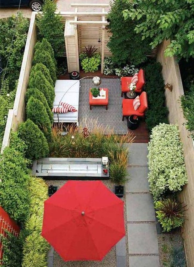 Red Umbrellas Over Urban Garden
