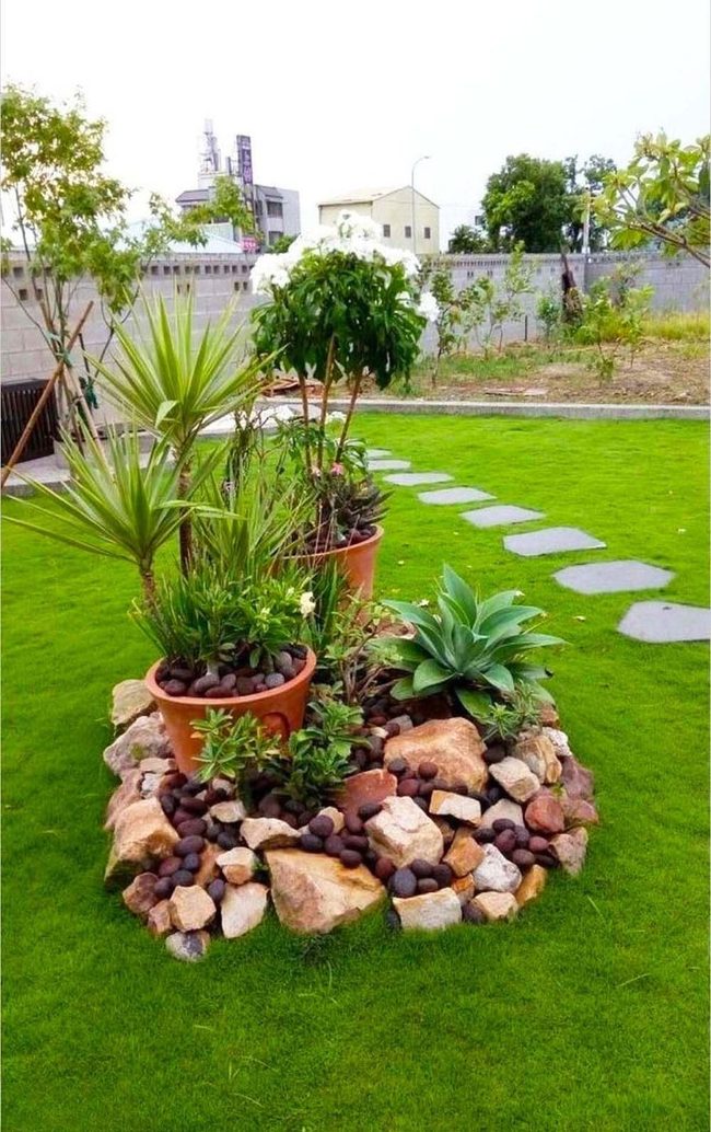 Terracotta Pots And River Stones Garden