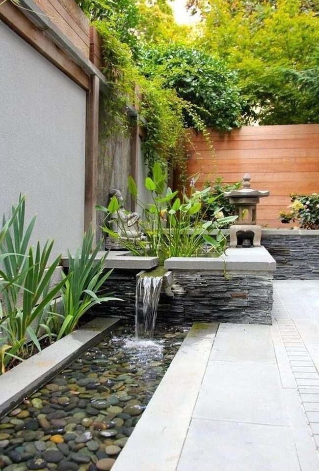 Stone Pathways Through Layered Greenery And Water
