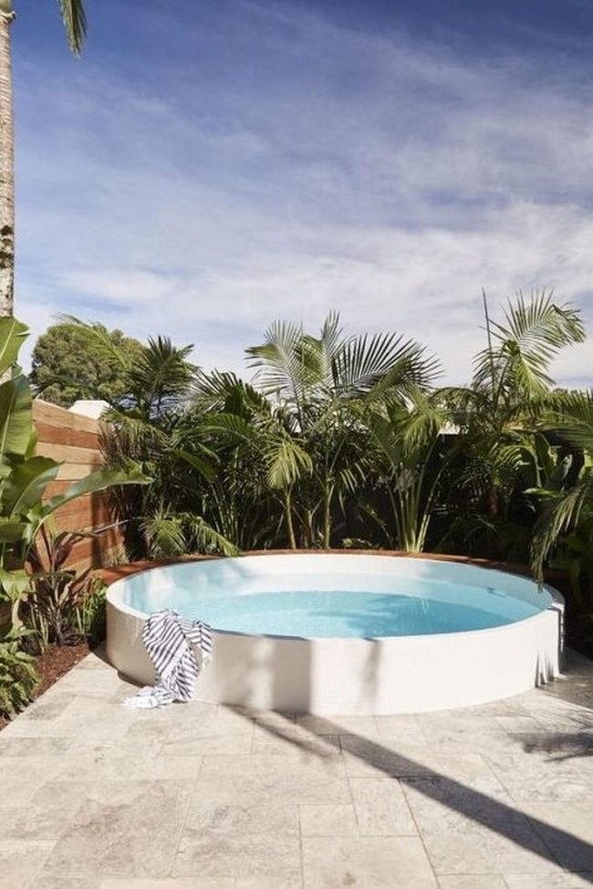 White Curved Pool With Tropical Palms