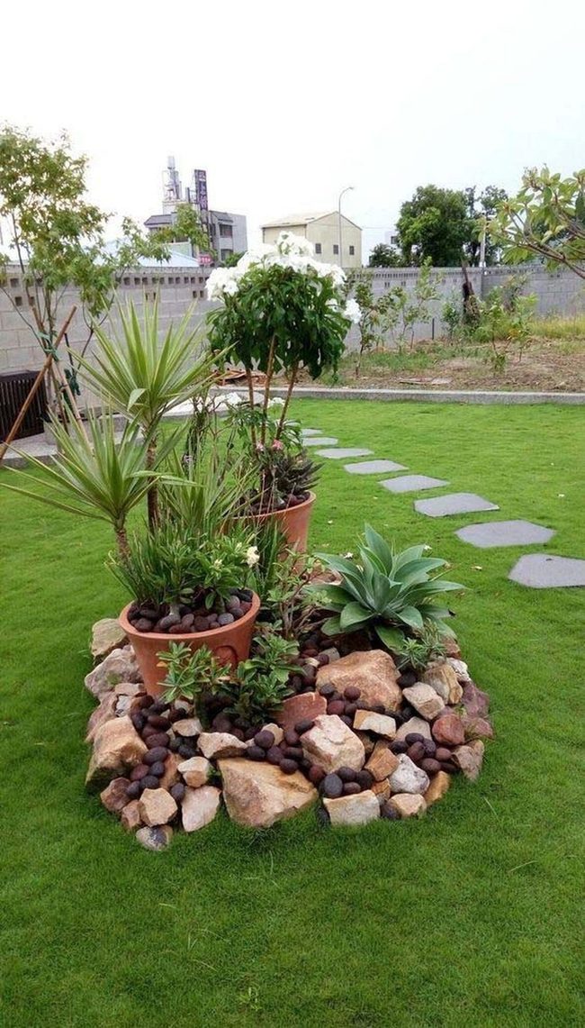 Stacked Stone Island With Potted Succulents
