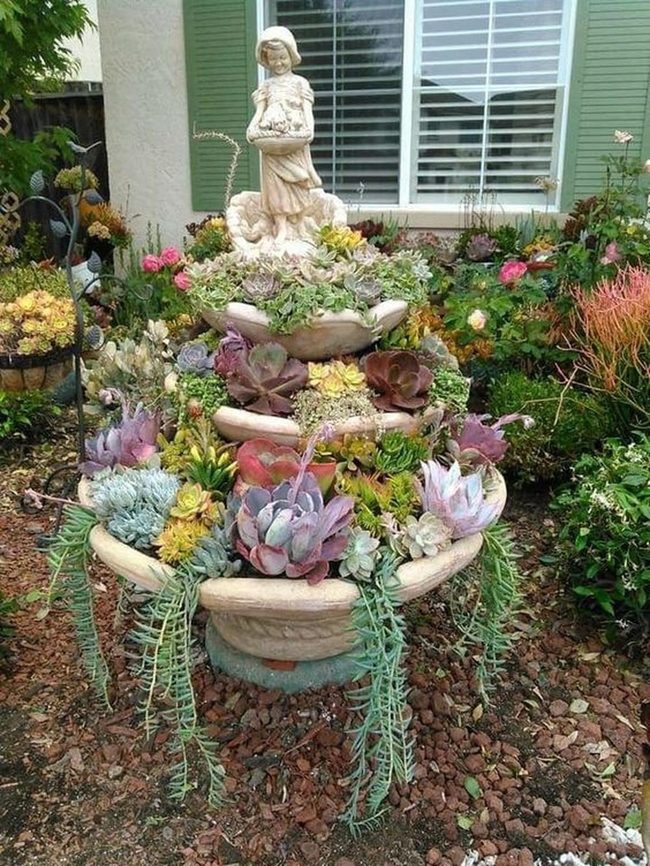 Succulent Tower With Flowering Statue