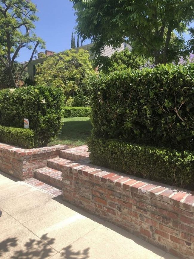 Blue Sky Garden With Red Brick Walls