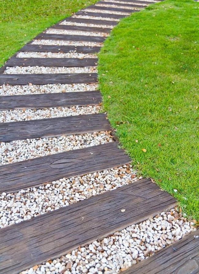 Dark Wood Path Through Green Lawn