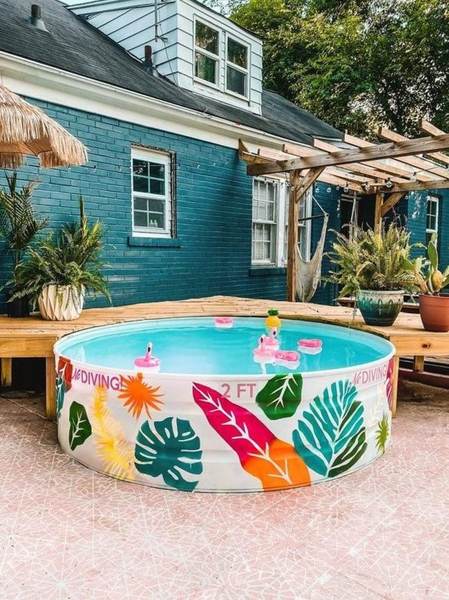 Leaf-Patterned Pool With Pink Tile Accents