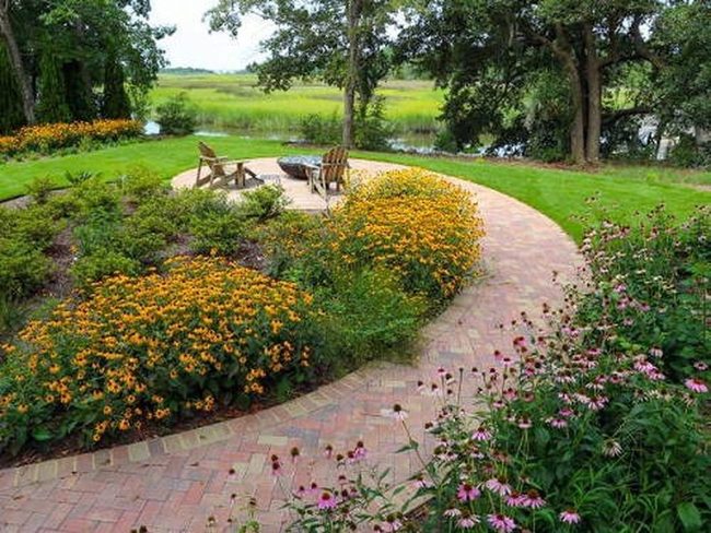Curved Brick Path Through Blooming Gardens