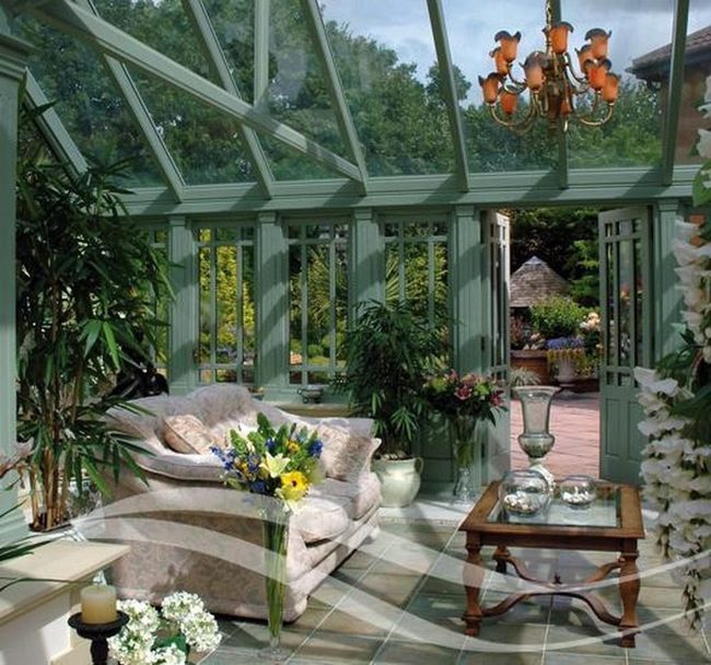 Pale Green Sunroom With Overflowing Plants