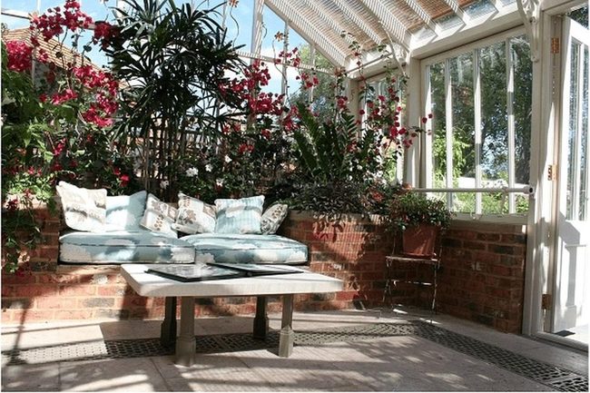 Sunlit Red Flowers And Brick Warmth