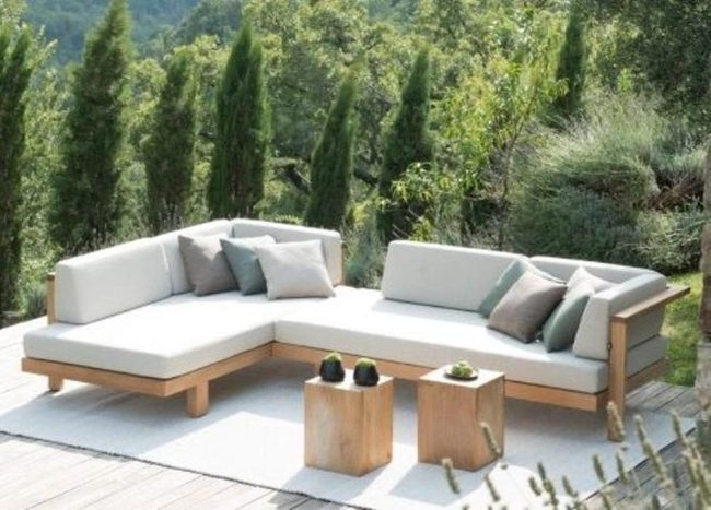 Green Walls And Natural Wood Seating