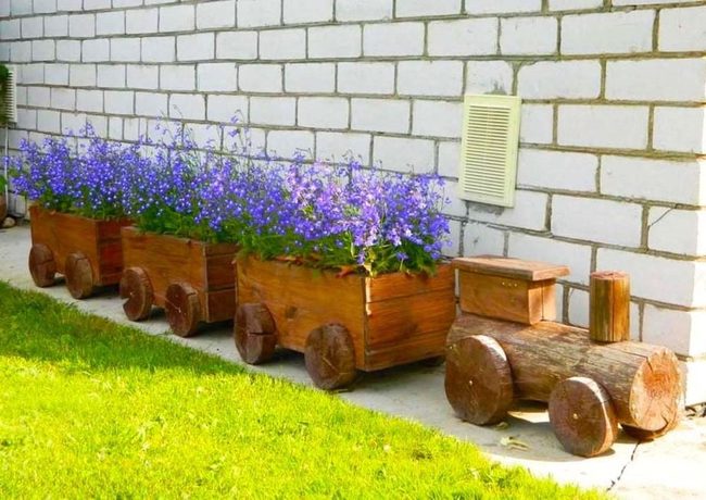 Blue Lobelia Train Through White Brick
