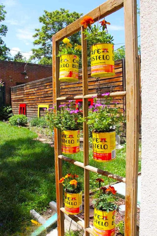 Yellow Cans Overflow With Blooming Color