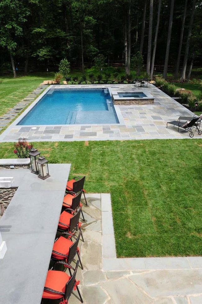 Colorful Stone Pool With Fire Gathering Space