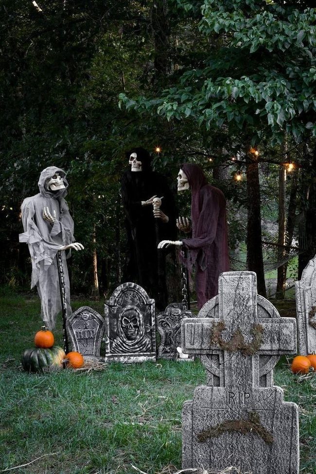 Ghostly Figures Among Glowing Pumpkins